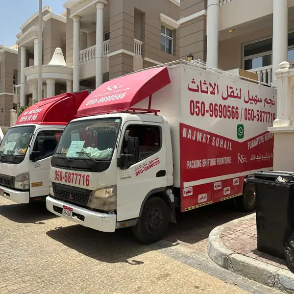 Movers in Abu Dhabi loading packed items into the moving truck