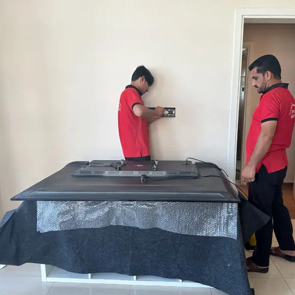 Movers in Abu Dhabi reassembling furniture after the move