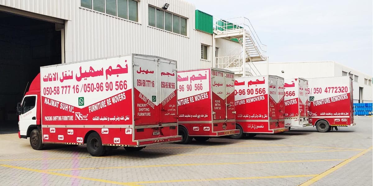 Movers in Abu Dhabi with multiple trucks parked
